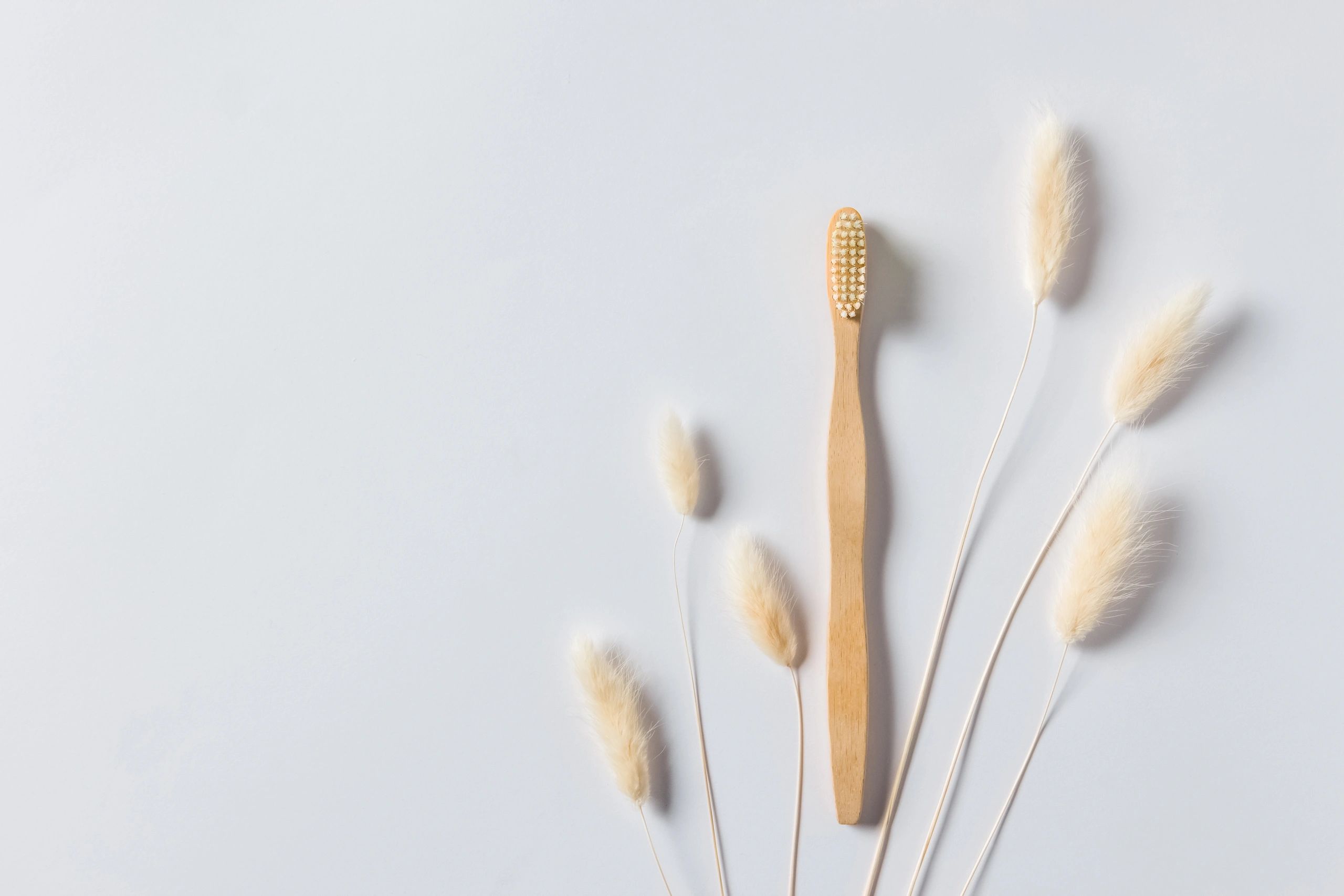 Dental hygiene tools and toothbrush on a clean surface