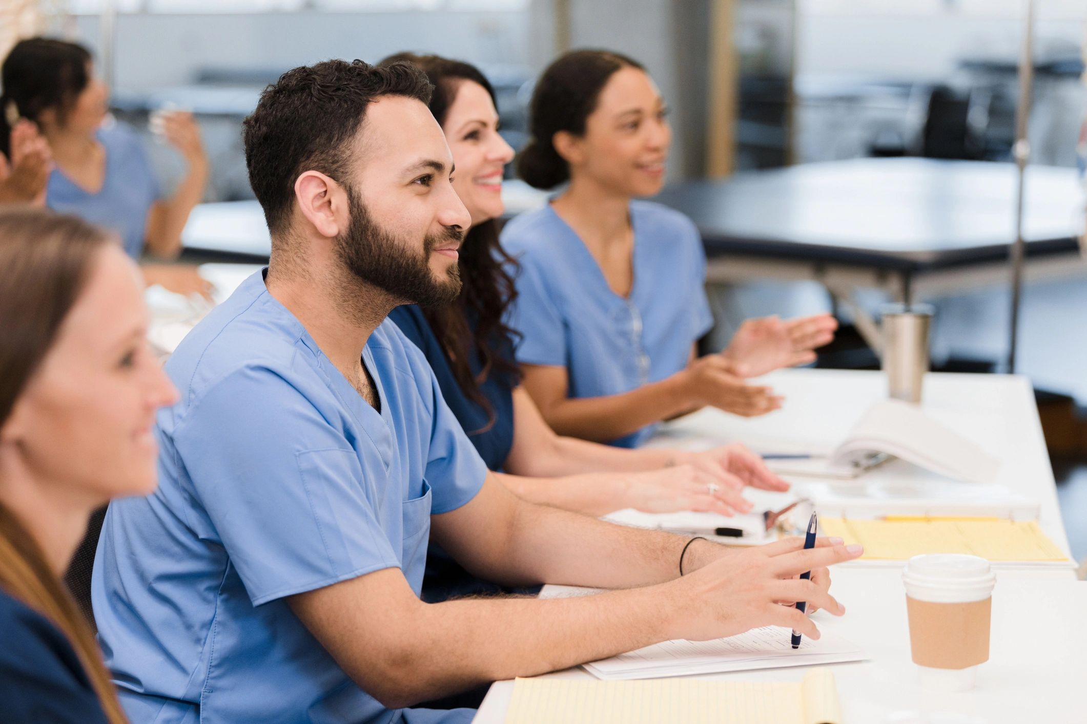 Attendees listening during a training session