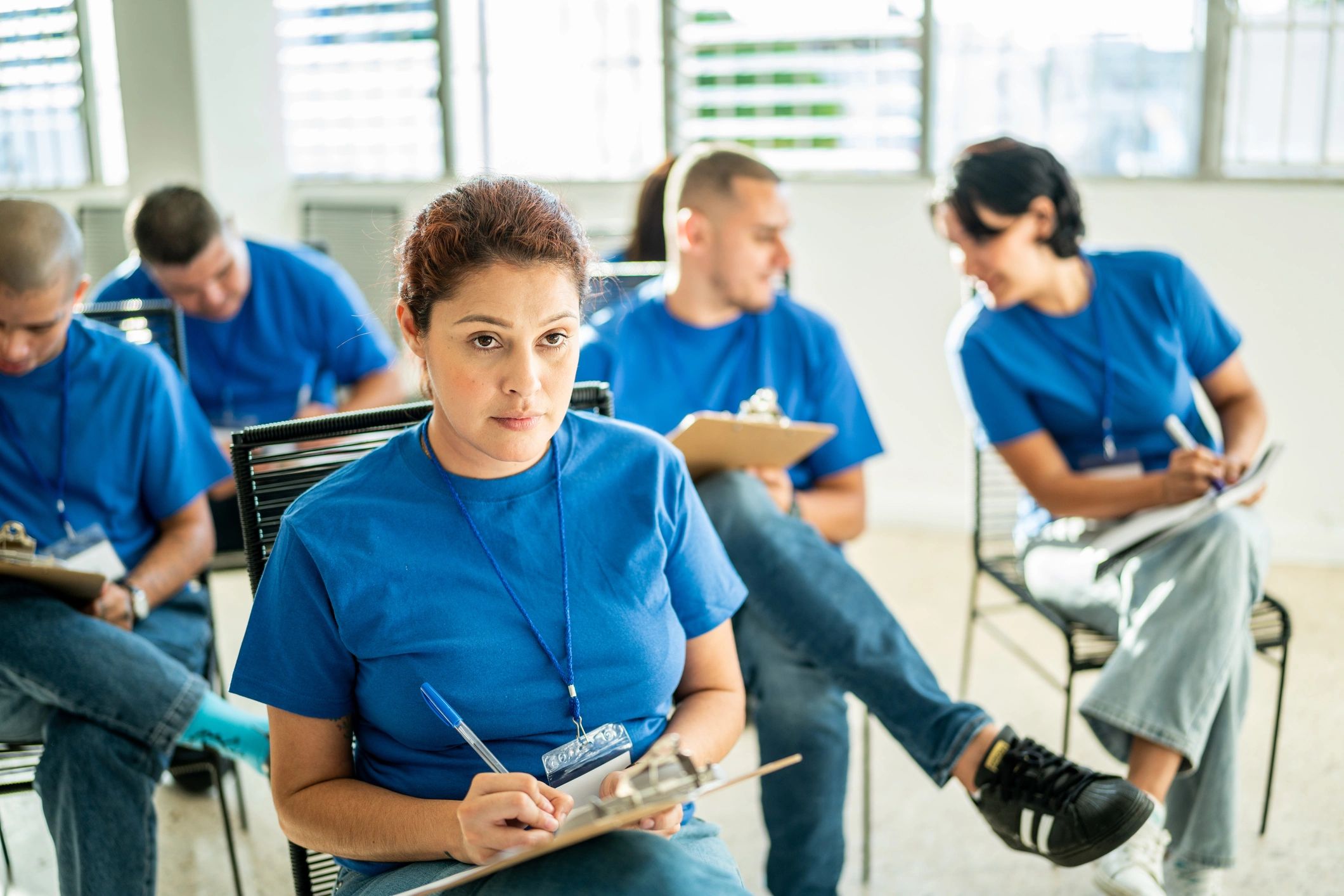Woman taking notes during a meeting